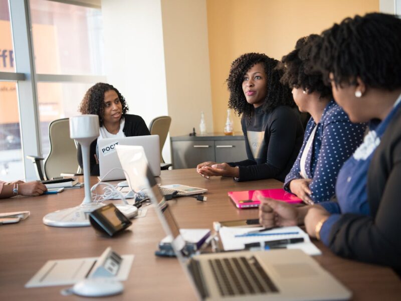Professionals in conference room discussing IT strategy